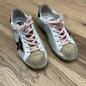 Golden Goose Super-Star with leopard star and black glitter heels.